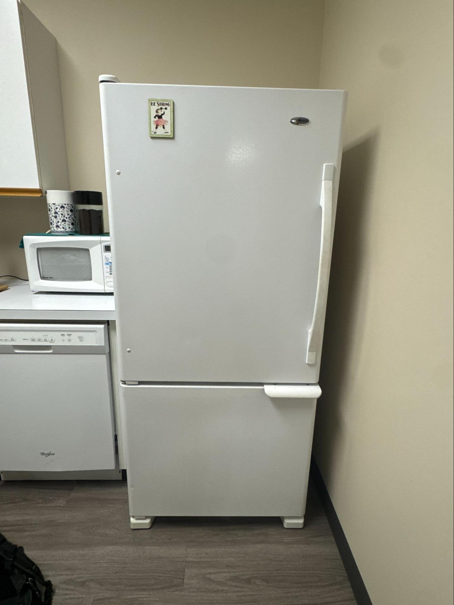 Amana refrigerator and freezer inspected for water buildup and a clogged drain line in Gresham, Oregon