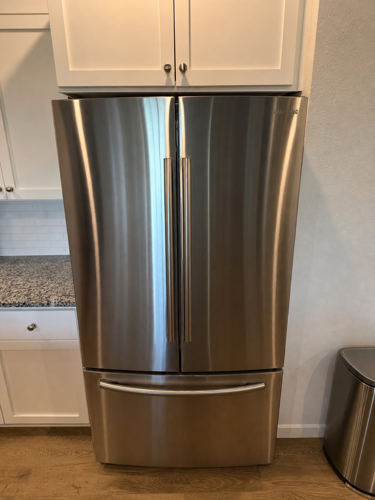 Samsung RF261BEAESR refrigerator inspected for water-line installation in Beaverton, Oregon